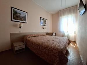 Postel nebo postele na pokoji v ubytování Hotel Lea
