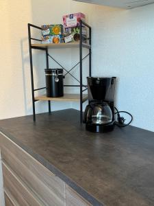a coffee maker on a counter in a room at Fewo Naturblick in Wiesenthau