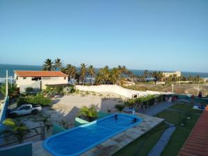 an aerial view of a swimming pool at a resort at Pousada Praiamar in Beberibe