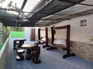 a group of chairs and tables on a patio at Pousada Praiamar in Beberibe