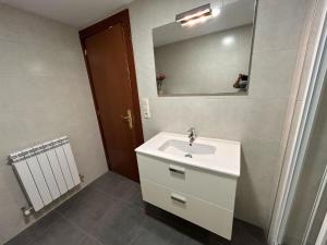 a bathroom with a sink and a mirror at Casa Palafox Fitero in Fitero +49 photos
