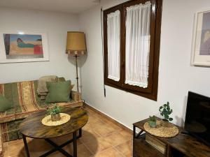 a living room with a couch and a table at Casa Palafox Fitero in Fitero