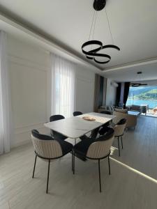 a dining room with a table and chairs at Royal Terrace Konjic in Železnička Stanica Ostrožac