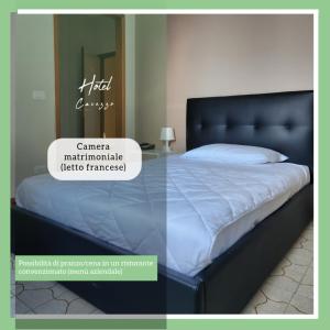 a picture of a bed in a room at Hotel Cavezzo in Cavezzo +16 photos