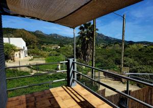 a balcony with a view of the mountains at Casa Rural El Bressol in Barraca de Aguas Vivas
