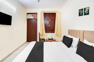 Voodi või voodid majutusasutuse Hotel O YATRA INN toas