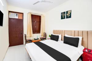 Voodi või voodid majutusasutuse Hotel O YATRA INN toas