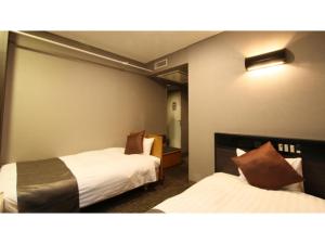 Postel nebo postele na pokoji v ubytování Hotel AreaOne Chitose - Vacation STAY 96125v + 14 fotografií