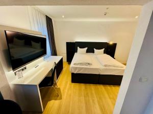 Postel nebo postele na pokoji v ubytování DORMERO Hotel Wilhelmshaven + 25 fotografií