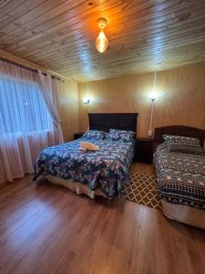 Postel nebo postele na pokoji v ubytování "Cabaña A y M"