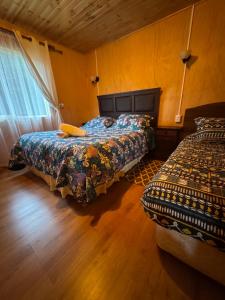 Postel nebo postele na pokoji v ubytování "Cabaña A y M"