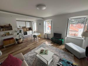 a living room with a couch and a table at Casa Lumina - new 2025 in Piran +27 photos