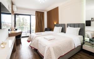 Łóżko lub łóżka w pokoju w obiekcie Hotel Lajka Luxury