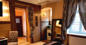 a living room with a door and a window at Central Apartments in Poznań