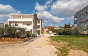 a street in a city with a building at Gorgeous Apartment In Novalja With Wifi in Novalja