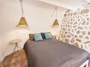 Postel nebo postele na pokoji v ubytování Agroturismo Finca Can Sec