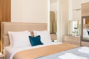 Łóżko lub łóżka w pokoju w obiekcie Hotel Lajka Luxury