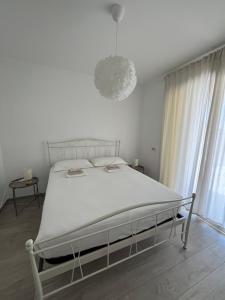 Un pat sau paturi într-o cameră la Villa Sole