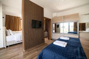 Łóżko lub łóżka w pokoju w obiekcie Hotel Lajka Luxury