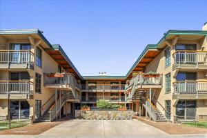 a large apartment building with balconies and stairs at Modern Condo, 1 Block to Gondola - Ideal Vacation Location in Aspen