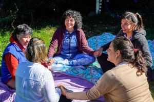a group of women sitting on a blanket at Re-Crearte Centro Holístico in San Carlos de Bariloche