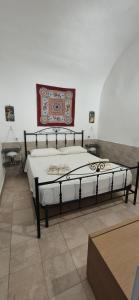 Ένα ή περισσότερα κρεβάτια σε δωμάτιο στο NONNA ADRIANA