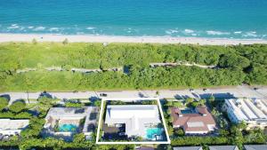 an aerial view of a beach and the ocean at Beachside 2BR 2BA - Pool & Balcony - Steps to Boca Beach in Boca Raton +34 photos