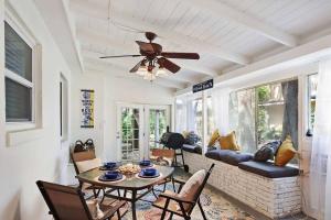 a living room with a couch and a table at Brice Sea Shell Stay in Jekyll Island