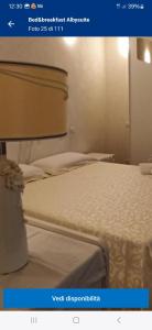a picture of a bed in a room at Alby suite in Termoli