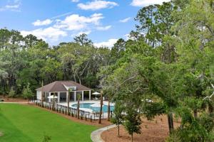 an estate with a swimming pool and a gazebo at Moorings 206 in Jekyll Island