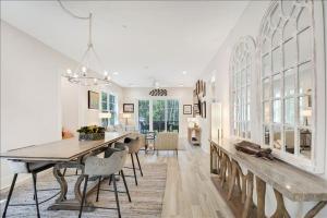 a dining room and living room with a table and chairs at Moorings 43 in Jekyll Island