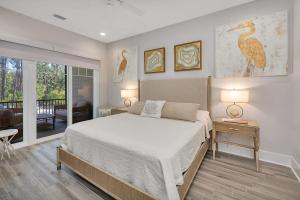 a bedroom with a large bed and a living room at Moorings 43 in Jekyll Island +58 photos