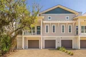 a large house with three garages in front of it at Moorings 43 in Jekyll Island
