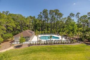 an aerial view of a house with a swimming pool at Moorings 43 in Jekyll Island