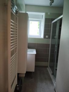 a bathroom with a sink and a window at Gîte et chambre d'hôtes Les Authentiques in Saint-Estèphe +12 photos
