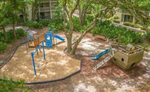 a park with a playground with a slide at Villa 401 in Jekyll Island