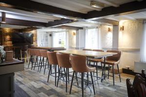a dining room with a table and chairs at The Ingram Arms in Laughton
