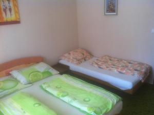 A bed or beds in a room at Penzion u Skaláků