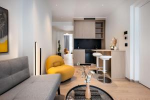 a living room with a couch and a table at Urban K in Athens