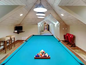 a pool table in a room with a bowl of balls at Stone Mountain Vista in McHenry