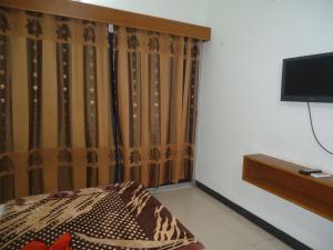 Llit o llits en una habitació de Unity Inn