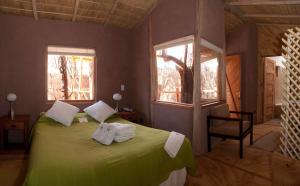 Ένα ή περισσότερα κρεβάτια σε δωμάτιο στο Hotel Kimal