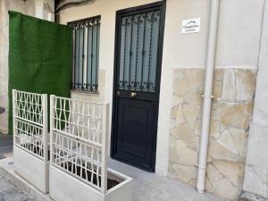 a black door on the side of a building at Wonderful house in Catania