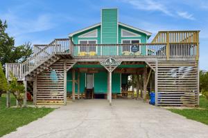 a house with a deck on top of it at Lori's Lair #5-7 in Avon