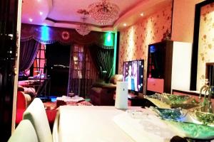 a living room with a table and a couch at Private Room In Apartment with Sea & Hilton View in Alexandria +181 photos