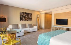 The Yucatan Playa Del Carmen, Tapestry Collection By Hilton的电视和/或娱乐中心