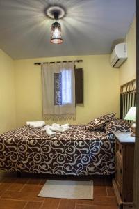Postel nebo postele na pokoji v ubytování Apartamentos Rurales La Casa de Luis