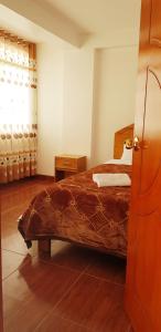 Postel nebo postele na pokoji v ubytování PATAWASI Guest House Cusco