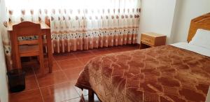 Postel nebo postele na pokoji v ubytování PATAWASI Guest House Cusco