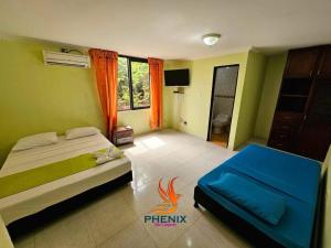 Postel nebo postele na pokoji v ubytování Hotel Phenix